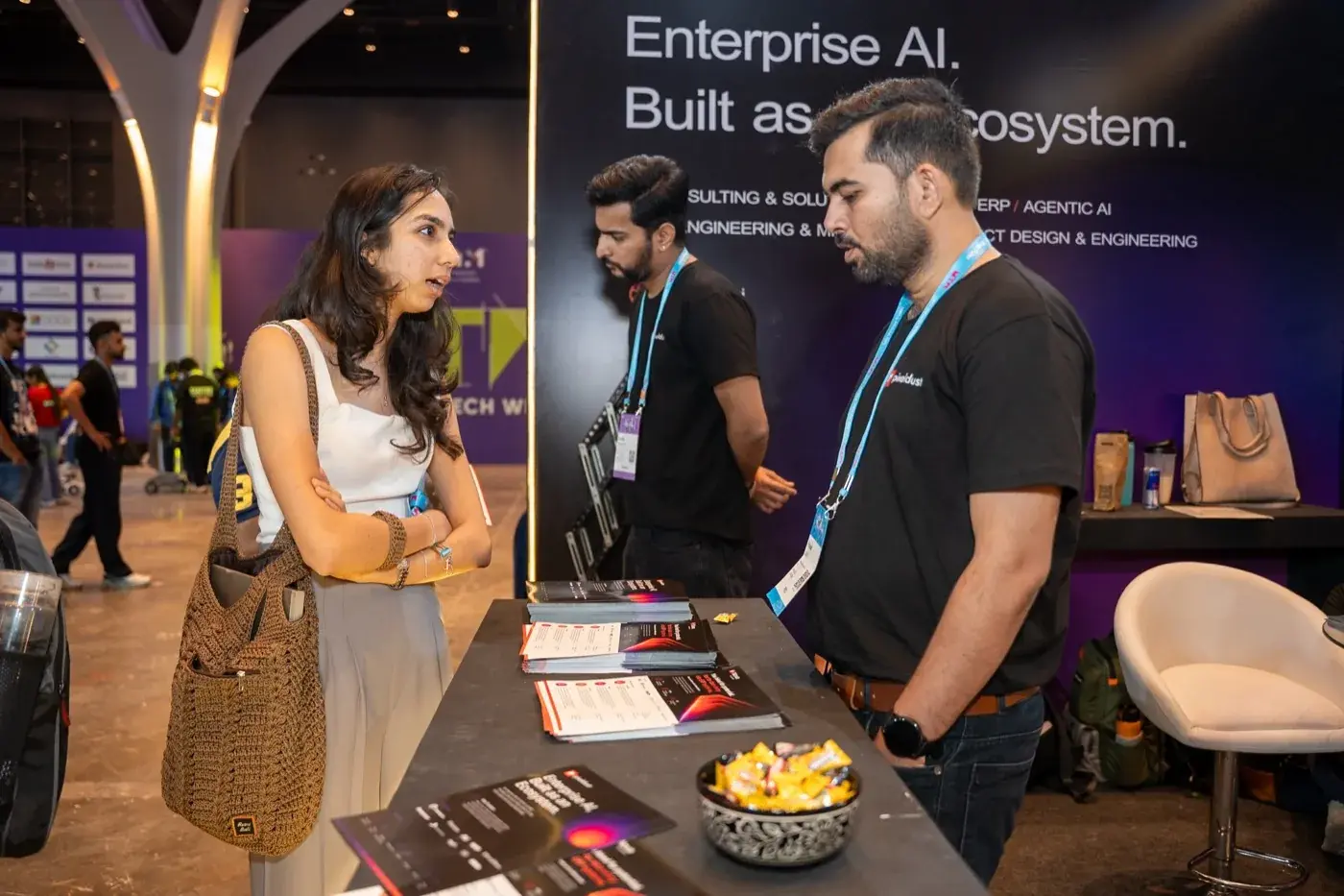 Talking with visitors at the booth